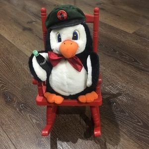 Coca Cola penguin in rocking chair